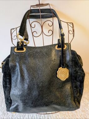 Vince Camuto Black Leather Shoulder Bag with Gold Medallion Accent